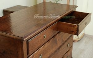 Reproduction of an antique chest of drawers handmade in planed and antiqued solid walnut wood